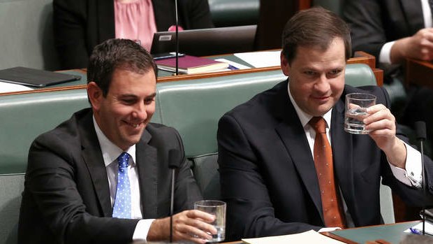 Labor MPs Jim Chalmers and Ed Husic clink glasses as Immigration Minister Scott Morrison rises to take the call during question time on Thursday.