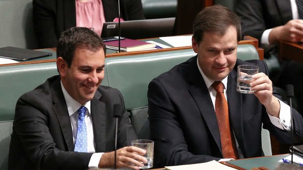 Labor MPs Jim Chalmers and Ed Husic clink glasses as Immigration Minister Scott Morrison rises to take the call during question time on Thursday.