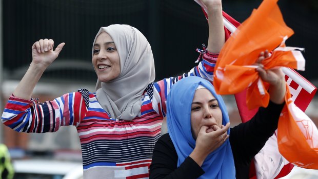 Erdogan supporters celebrate outside his official residence in Istanbul on Sunday.