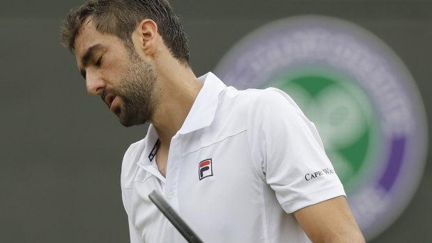 Marin Cilic of Croatia loses a point to Guido Pella of Argentina during their men's singles match on the fourth day at the Wimbledon Tennis Championships in London, Thursday July 5, 2018. (AP Photo/Kirsty Wigglesworth)
