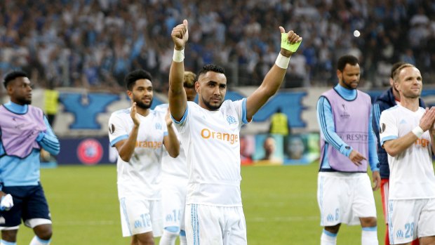Solid showing: Dimitri Payet salutes the fans after Marseille's 2-0 win.