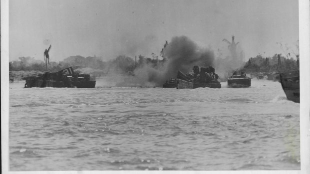 Driving into the beach at Peleliu Island in the face of heavy mortar fire, Coast Guard manned landing craft deliver men and supplies.