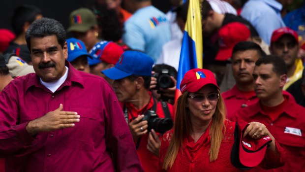 Venezuelan President Nicolas Maduro and his wife Cilia Flores attend a May Day rally on Tuesday.