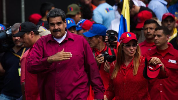 Venezuelan President Nicolas Maduro and his wife Cilia Flores attend a May Day rally on Tuesday.