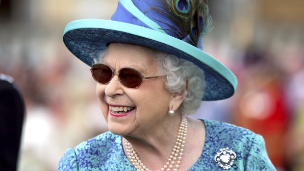 Queen Elizabeth II donned sunglasses at a garden party at Buckingham Palace on May 31.