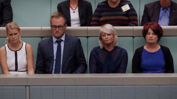 Family members of the Australian victims of MH370 were acknowledged by the Parliament during a condolence motion in Parliament House on Wednesday. Left to right front row, Melia Burrows and Jayden Burrows children of Mary and Rodney Burrows, Amanda Lawton daughter of Catherine and Robert Lawton and Debra Hangar Robert's sister. Photo: Andrew Meares