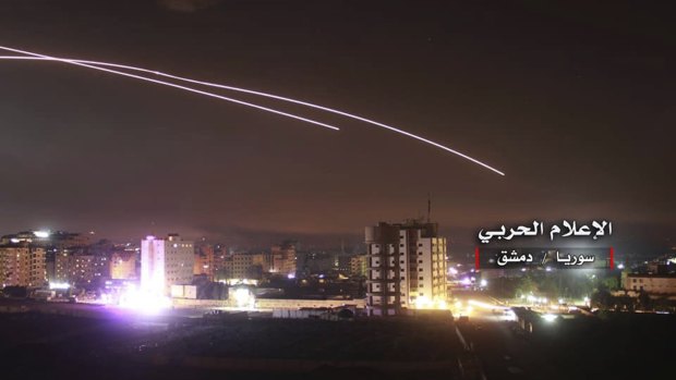 Missiles rise into the sky as Israeli missiles hit air defence position and other military bases, in Damascus, Syria. 