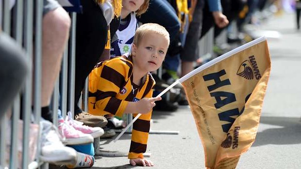 A young Hawk supporter at the annual grand final parade through the streets of Melbourne.
