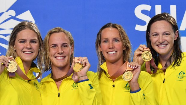 Golden smiles: Shayna Jack, Bronte Campbell, Emma McKeon and Cate Campbell after breaking the 4x100 metre freestyle relay world record.