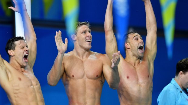 Perfect ending: Mitch Larkin, Jake Packard and Grant Irvine celebrate after Australia win the 4 x 100m medley relay.