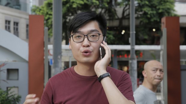 Leader of the Hong Kong National Party Andy Chan speaks on his mobile on Tuesday. 