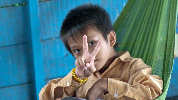 An unamed orphan at Tonle Sap lake, near Siem Reap, Cambodia, in 2013.