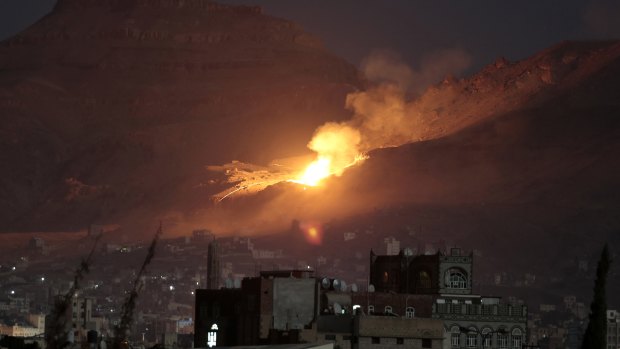 Fire and smoke rise after a Saudi-led air strike hit a site believed to be one of the largest weapons depots on the outskirts of Sanaa in October 2016.