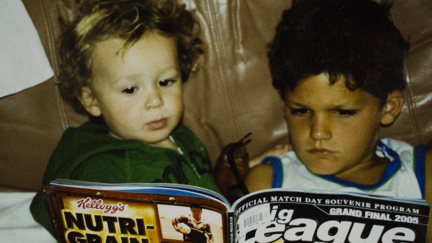 Nathan Cleary (right) studies Big League magazine before the 2005 grand final.