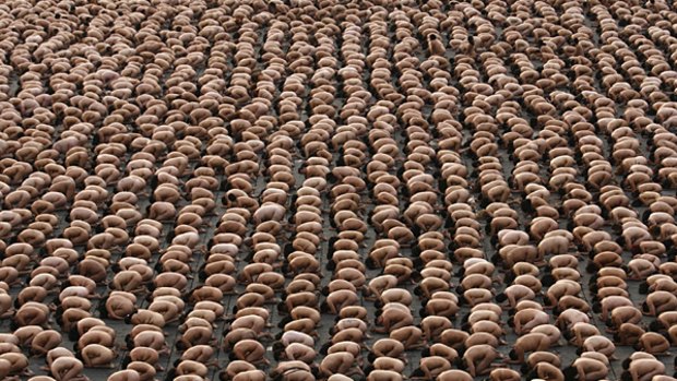 Thousands of naked people crouch in Mexico City's main Zocalo plaza for Spencer Tunick in 2007.