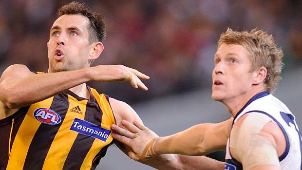 Hawthorn's Luke Hodge battles with Geelong's Josh Caddy at the MCG back in round 15.