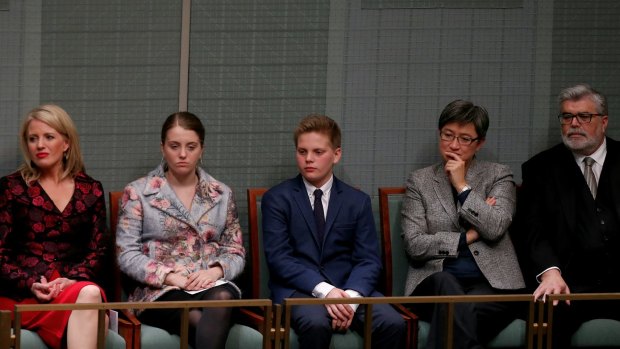 Opposition Leader Bill Shorten's wife Chloe and children Georgette and Rupert listen as he delivers the budget reply speech.