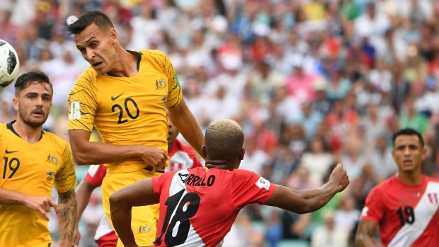Future leader: Trent Sainsbury heads the ball against Peru.