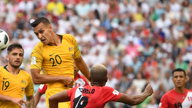 Future leader: Trent Sainsbury heads the ball against Peru.