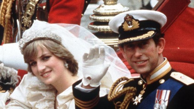 The Princess and Prince of Wales wave from their carriage on their wedding day in 1981.