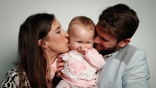 Bethan McElwee and Jonathan McElwee with their 1-year-old daughter Aviana, who has spinal muscular atrophy.