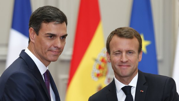 French President Emmanuel Macron, right, shakes hands with Spanish Prime Minister Pedro Sanchez after a joint press conference at the Elysee Palace on  Saturday.