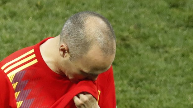 The end: Andres Iniesta leaves the pitch after Spain's loss to Russia.