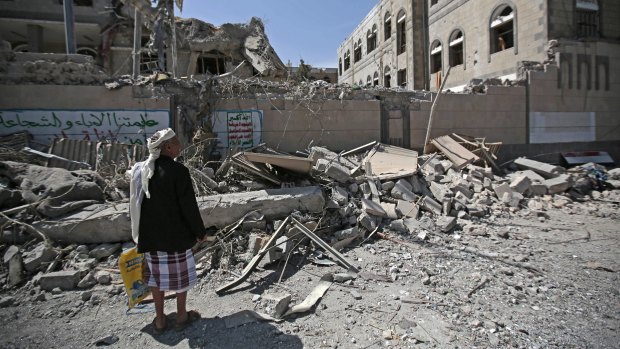 A man looks at damaged buildings after deadly air strikes in and near the presidential compound in Sanaa, Yemen, this month. The war has entered its fourth year.