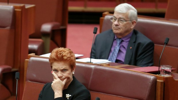 One Nation Senator Pauline Hanson listens as One Nation Senator Rod Culleton speaks in the Senate earlier on Thursday.