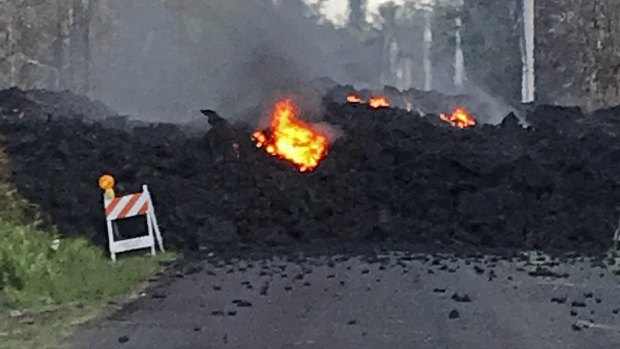 Lava flowing over Mohala Street in the Leilani Estates on the Big Island of Hawaii.