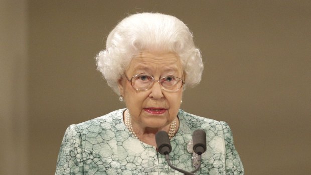 Britain's Queen Elizabeth II speaks during the formal opening of the Commonwealth Heads of Government Meeting in the ballroom at Buckingham Palace in London.