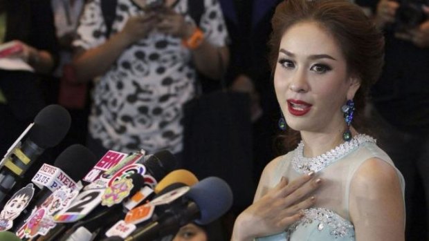 Outspoken ... Weluree Ditsayabut, 22, announces she is relinquishing her title as Miss Universe Thailand during a news conference at the Renaissance Hotel in Bangkok. 