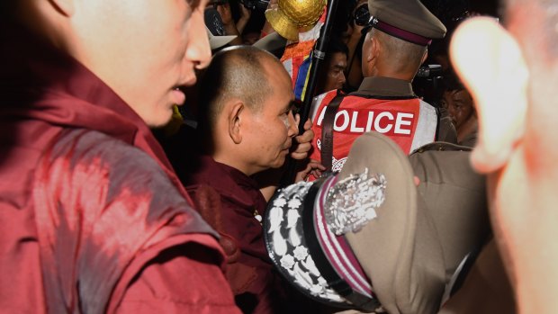 Kruba Boonchum, second from left, moments after returning from Tham Luang cave where he prayed with the trapped boys' families.