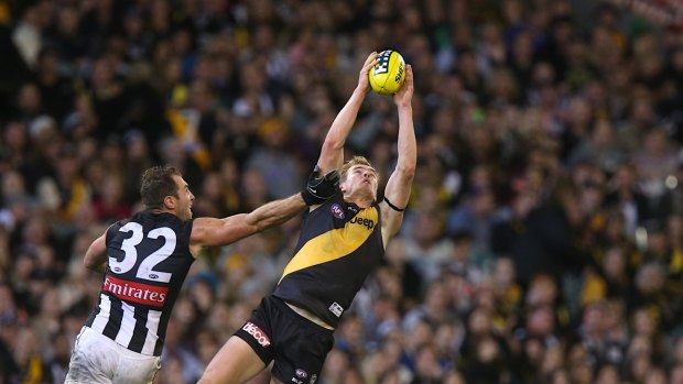 Trade play: David Astbury could help the Tigers secure Chris Yarran from Carlton