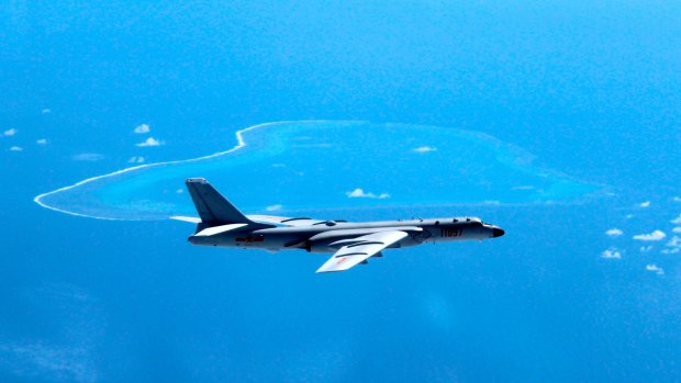 A Chinese H-6K bomber patrols the islands and reefs in the South China Sea - which has been a source of tension with neighbour Vietnam.