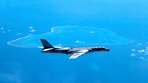 A Chinese H-6K bomber patrols the islands and reefs in the South China Sea. 