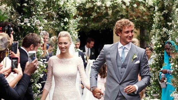 Beatrice Borromeo and Pierre Casiraghi leave their religious ceremony on Saturday.
