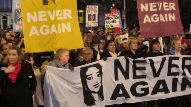 Abortion rights protesters held pictures of Savita Halappanavar as they marched through central Dublin last year, demanding  Ireland's government ensures abortions can be performed to save a woman's life.