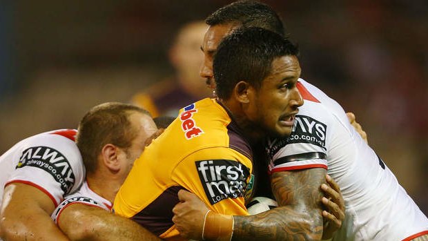 Brisbane fullback Ben Barba is tacked by St George Illawarra's defence in Wollongong.