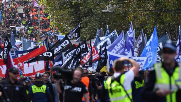 Workers filled LaTrobe Street as they make their way to the Magistrates Court.