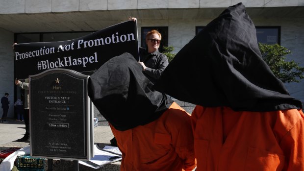 Demonstrators dressed as Guantanamo detainees to protest against Haskel's nomination.