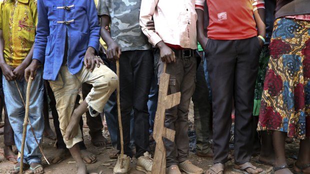 Former child soldiers stand in line for registration with UNICEF to receive a release package in Yambio, South Sudan in February. More than 300 child soldiers were released Wednesday by armed groups in South Sudan, the second-largest such release since civil war began five years ago. 