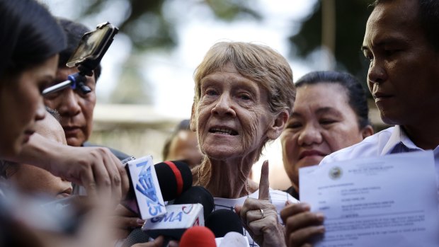 Australian missionary Sister Patricia Fox gestures as she is interviewed by reporters after she was released from custody at the Bureau of Immigration in Manila.