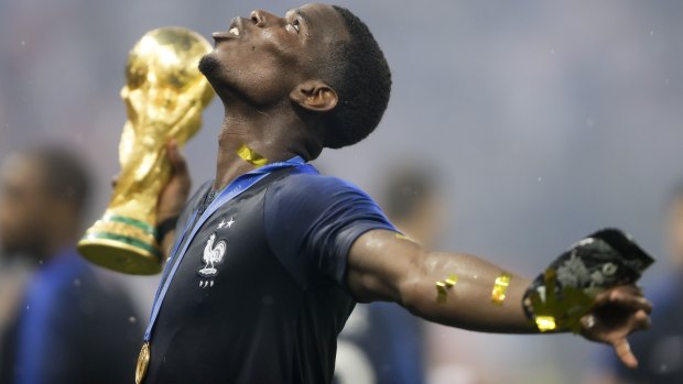 France's Paul Pogba celebrates with the trophy after the final match between France and Croatia at the 2018 soccer World Cup in the Luzhniki Stadium in Moscow.