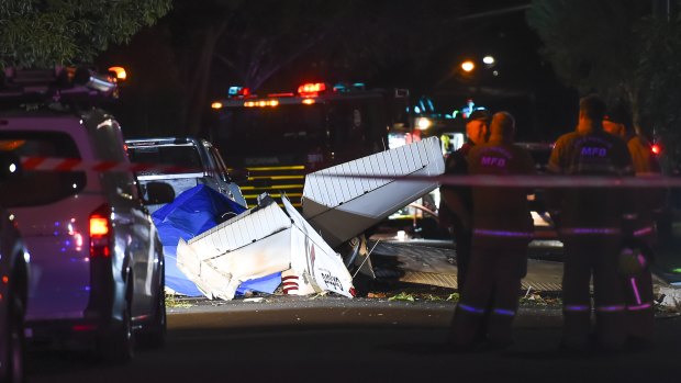 Police at the scene of the plane crash in Scarlet Street, Mordialloc, on Friday night.