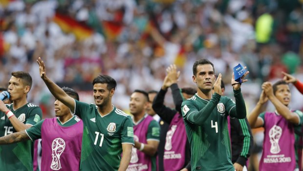 Mexican players celebrate after their win over Germany.