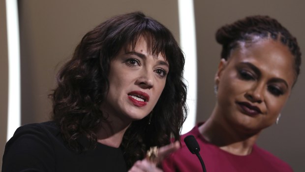 Actress Asia Argento, left, speaks about being raped by Harvey Weinstein, with jury member Ava Duvernay, during the closing ceremony of Cannes.