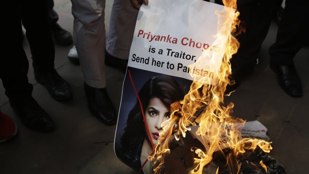 Activists of ultra right-wing Hindu Sena or Hindu Army burn posters featuring photographs of Indian actress Priyanka Chopra during a protest in New Delhi last week.
