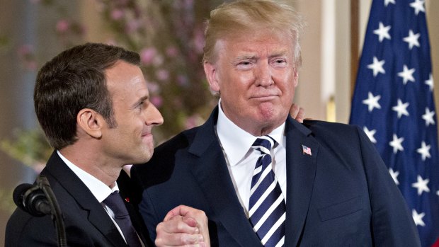 French President Emmanuel Macron, left, shows his affection for US President Donald Trump, at a news conference in Washington in April.
