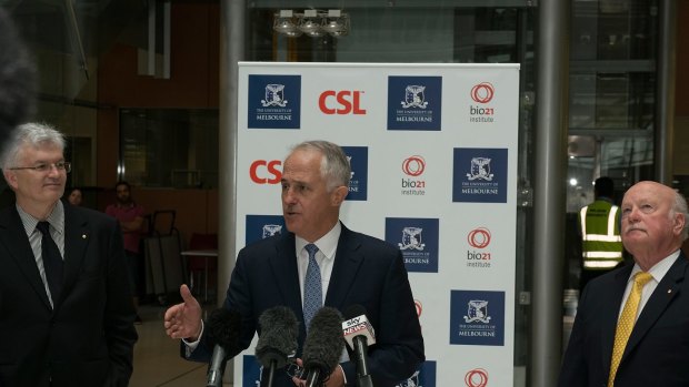 Glyn Davis (left) and Malcolm Turnbull (centre) jousted over industry collaboration last year. Pictured with CSL chairman John Shine at the announcement of a 5000-square-metre expansion of the university's  Bio21 Molecular Science and Biotechnology Institute